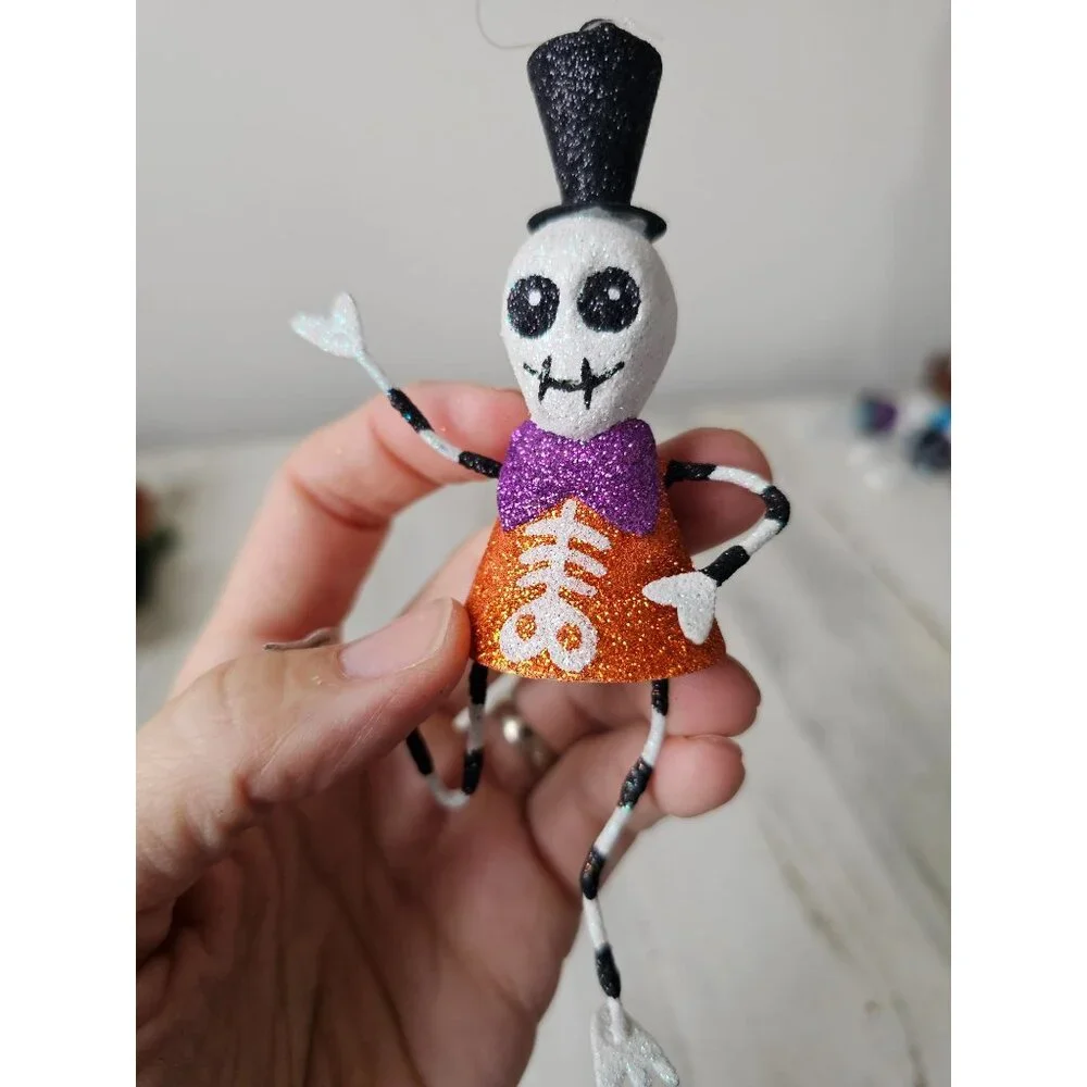 Pier 1 skeleton glitter ornament bow tie top hat Halloween Xmas tree black and w
